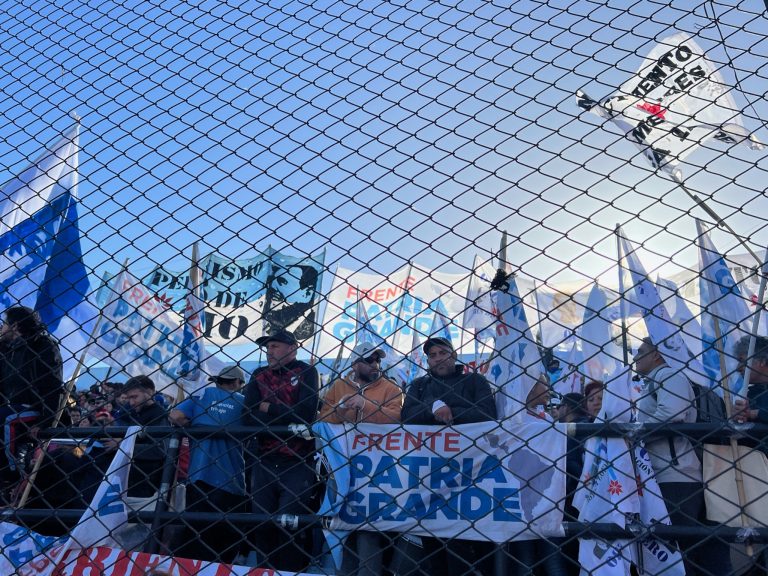 Political party demonstration, supporters with flags.