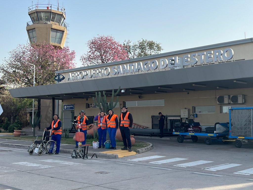 workers at the entrance of the airport